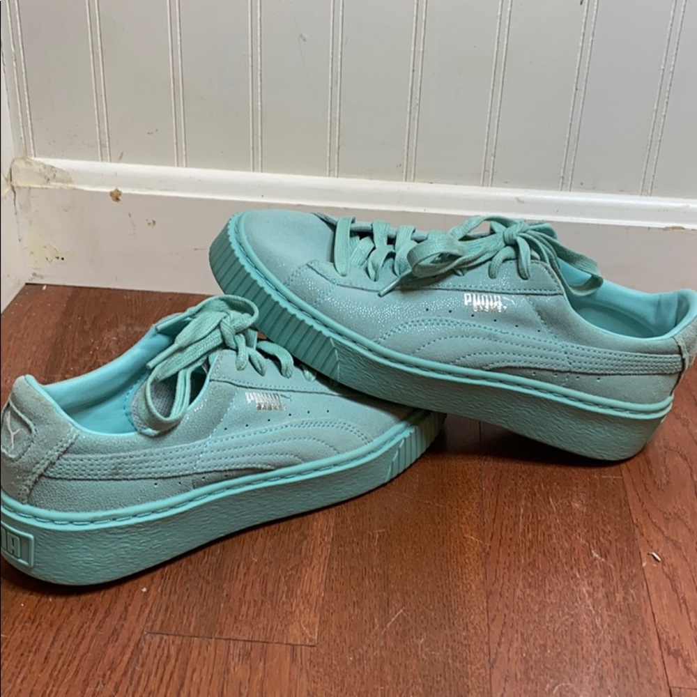 Teal PUMA sneakers
